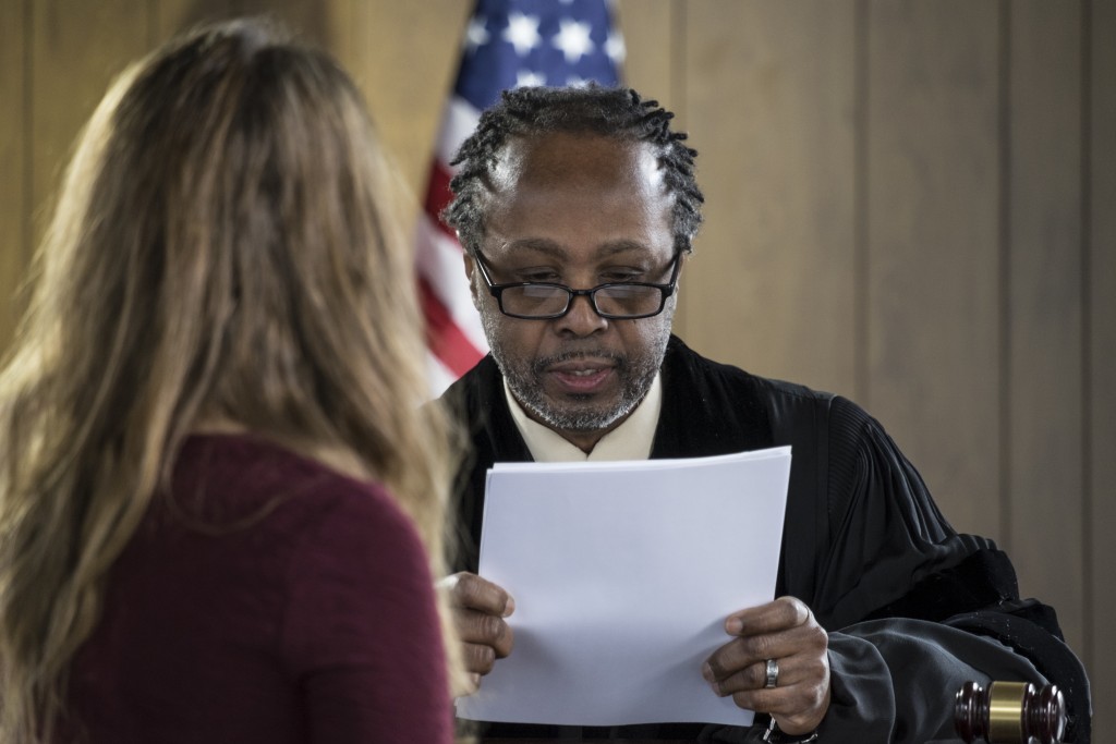 girl and judge inside a courtroom